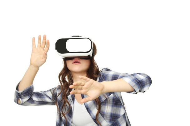 Young girl in virtual reality goggles on white background - Φωτογραφία, εικόνα