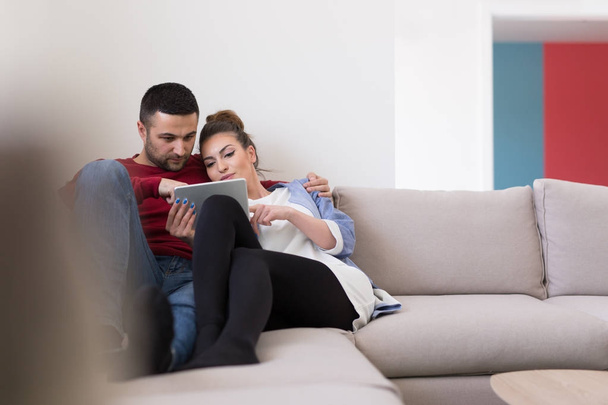 couple relaxing at  home with tablet computers - Photo, Image