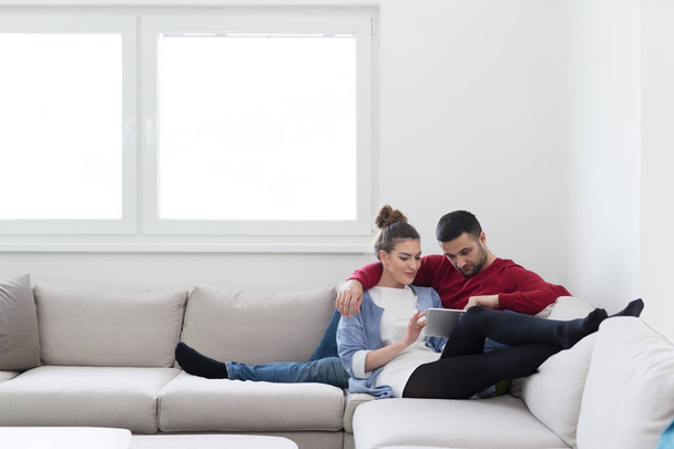 couple relaxing at  home with tablet computers - Fotoğraf, Görsel