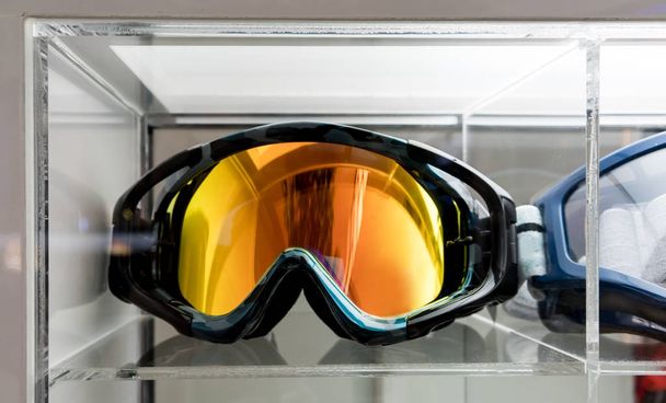 Motocross Goggles on acrylic display at store - Photo, Image