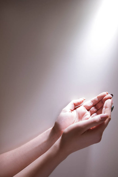 hands glowing light god grace fervent prayer - Φωτογραφία, εικόνα