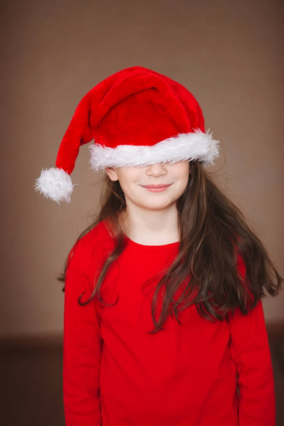happy little girl with santa hat - Zdjęcie, obraz
