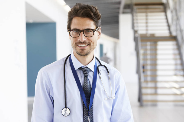 smiling male doctor with stethoscope - 写真・画像