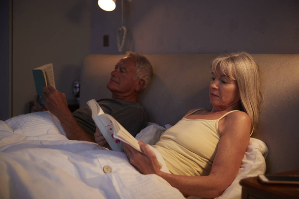 Senior Couple Lying In Bed  - Фото, изображение
