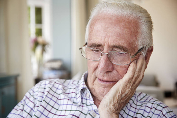 Worried senior man contemplating at home - Foto, Bild