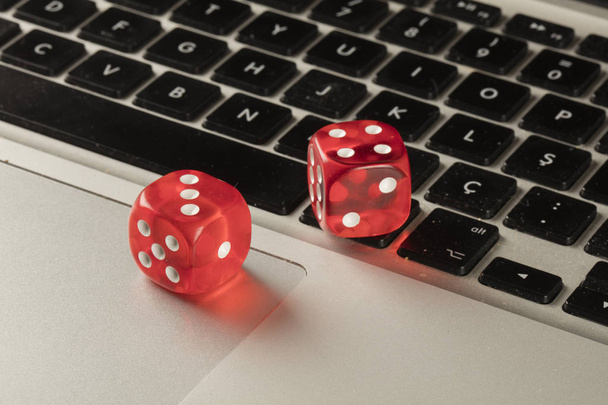 red color dice on keyboard close up - Valokuva, kuva
