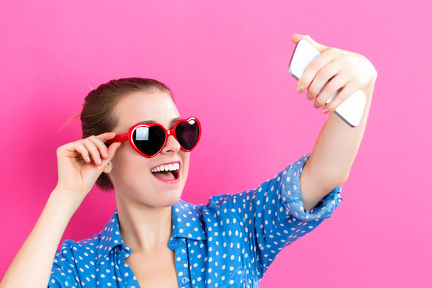 Young woman taking a selfie - Foto, Imagem