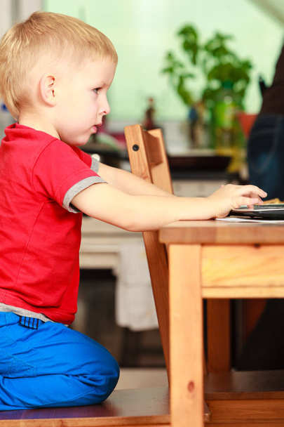 Little boy using laptop computer playing games - Photo, Image
