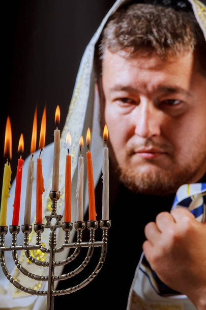 Hanukkah, a Jewish celebration. Candles burning in the menorah - Photo, Image