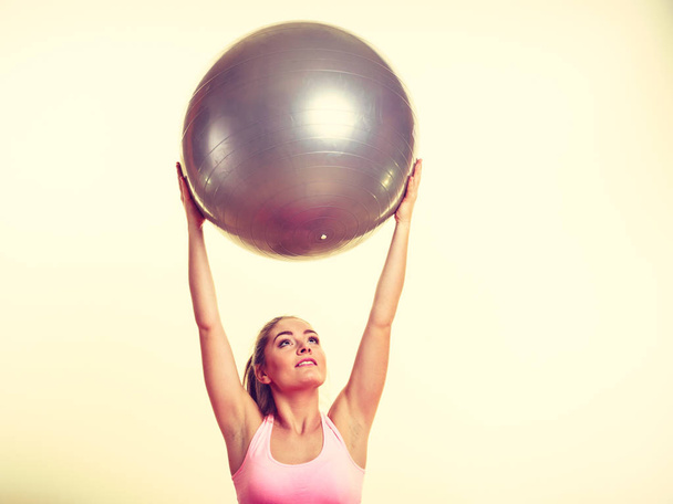 Girl exercising with fit ball - Fotó, kép