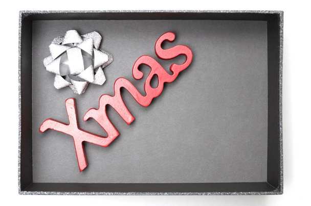 X-mas texto y cinta en caja de regalo negro
 - Foto, Imagen