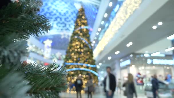 concept of holiday shopping. Blur the hall in the shopping center with Christmas decorations. 4k - Footage, Video
