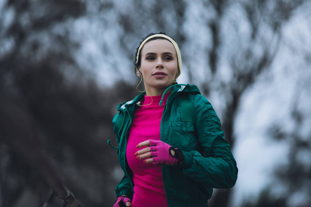 Woman jogging outside in cold winter day - Photo, Image
