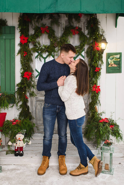 Happy beautiful young couple in love dressed in sweater staying  - Photo, image