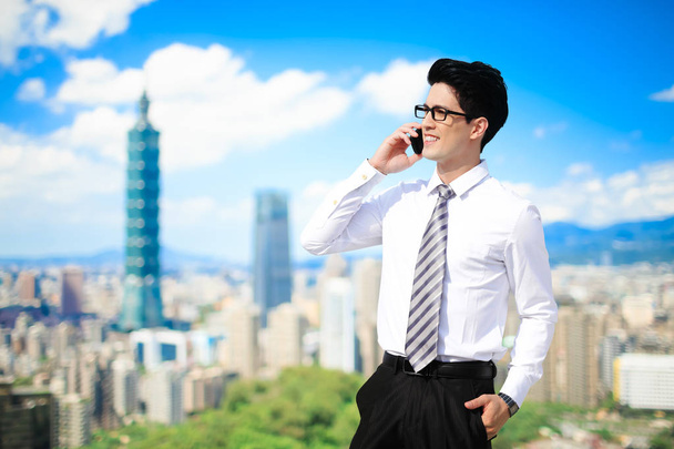 business man talking on  phone in the taipei - Foto, immagini