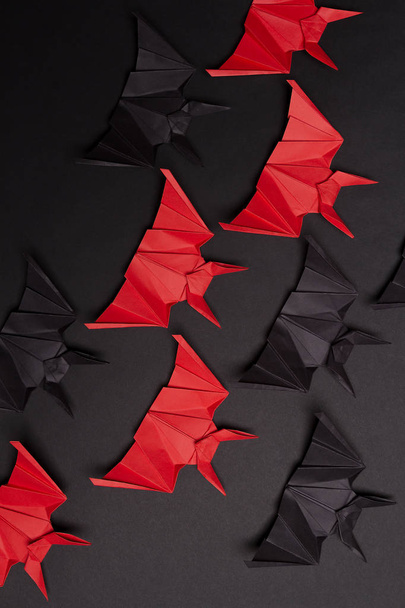 Halloween Background. Black background. Red and black bats - Φωτογραφία, εικόνα