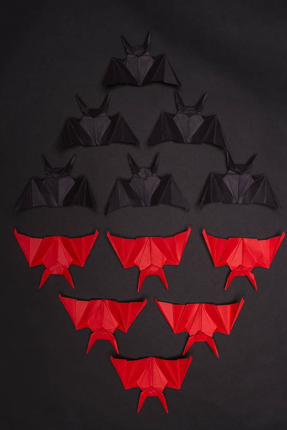 Halloween Background. Black background. Red and black bats - Фото, изображение