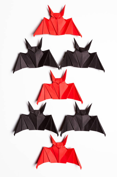 Halloween background. White background. Red and black bats - 写真・画像