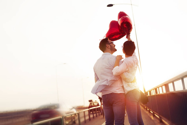 Couple hugging and kissing outdoors - Fotó, kép
