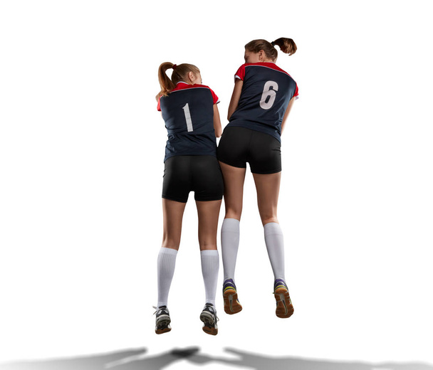 two female volleyball players celebrating point - 写真・画像