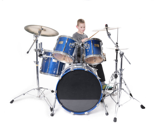 yount blond teen boy at drum kit - Photo, Image