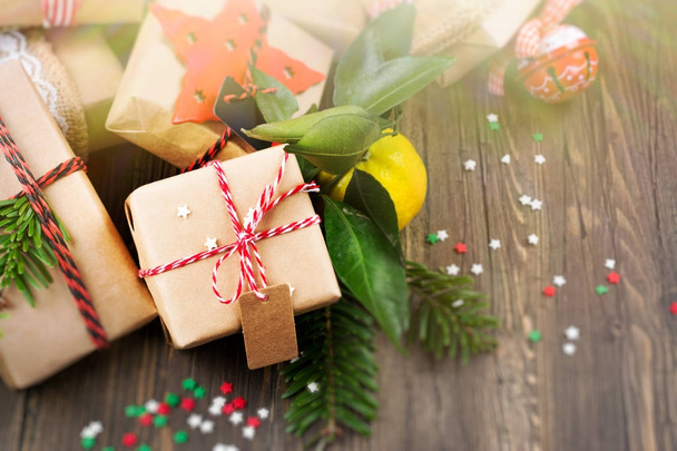 Many decorated Christmas presents on wooden background - Foto, imagen