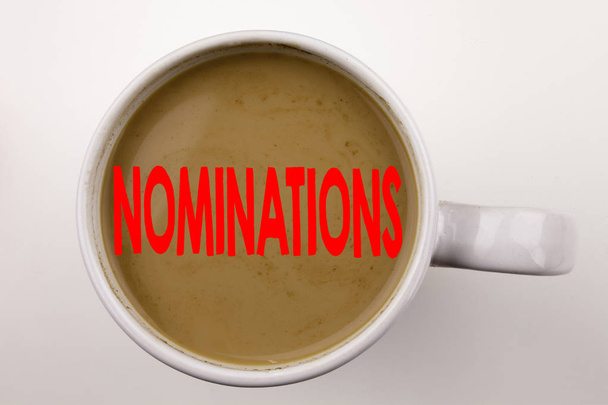 Word, writing Nominations text in coffee in cup. Business concept for Election Nominate Nomination on white background with copy space. Black text with red word. - Photo, Image