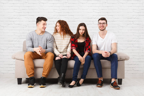 Happy young friends, casual people sitting on couch - Photo, Image