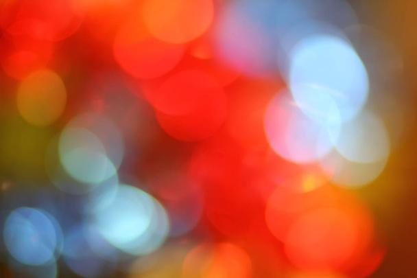 Abstraktní pozadí nový rok ostrého třpytivá světla, vánoční červená modrá žlutá holiday bokeh - Fotografie, Obrázek