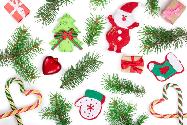 Christmas background with fir branches and Santa Claus isolated on white background. Top view. Flat lay - Foto, Imagen