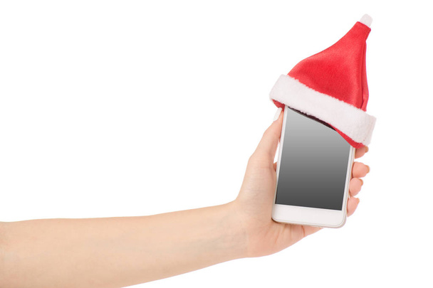 Female hand mobile phone smartphone Santa hat - Foto, afbeelding
