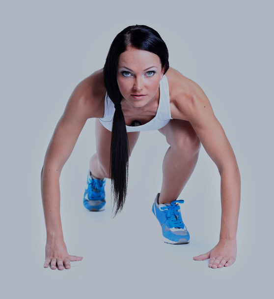 Mujer con ropa deportiva sobre fondo blanco
 - Foto, Imagen