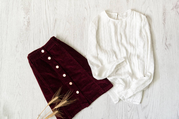 Burgundy suede skirt and white blouse. Fashionable concept. - Foto, imagen
