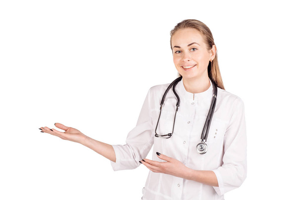 Female doctor with stethoscope show something and smile to you i - Zdjęcie, obraz