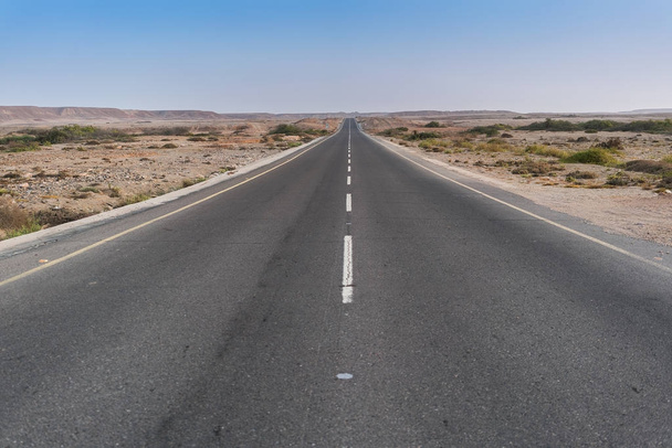 Road without cars in the Namibe Desert. Angola. - Photo, Image