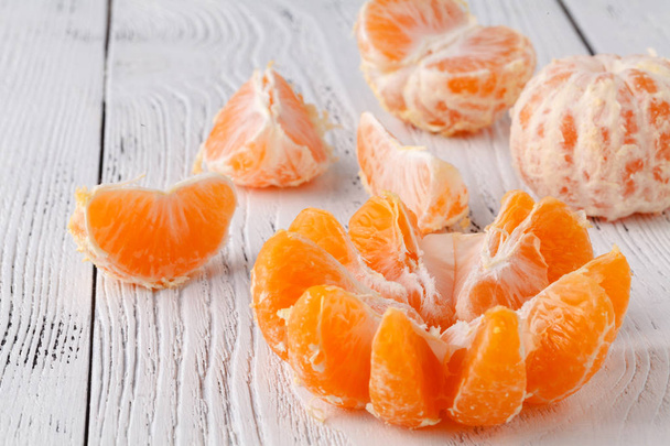 Mandarins on the white table - Φωτογραφία, εικόνα