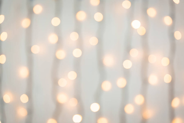 Christmas and Happy new year on blurred bokeh banner background of a luminous garland - Foto, Bild
