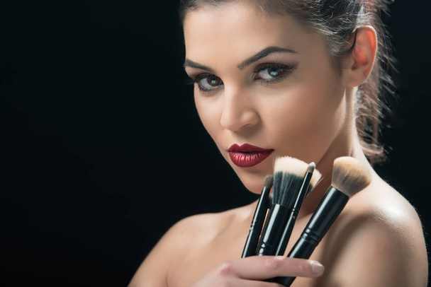  Girl  holding makeup brush in hand - Фото, изображение