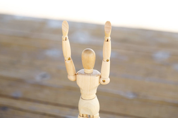 Wooden human with raised hands isolated - Foto, Imagem