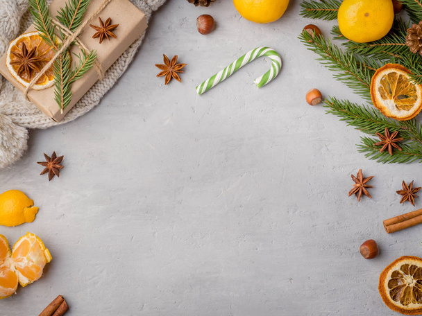 Winter hot chocolate drink in a Cup on a gray concrete background tangerines festive decorations Copy space - Photo, Image