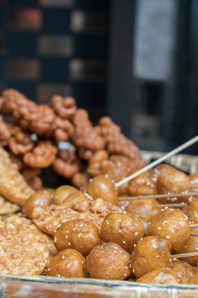 Chinese Street Food, Assortment of Baked Good, Close Up Selective Focus, Chengdu China - Foto, imagen