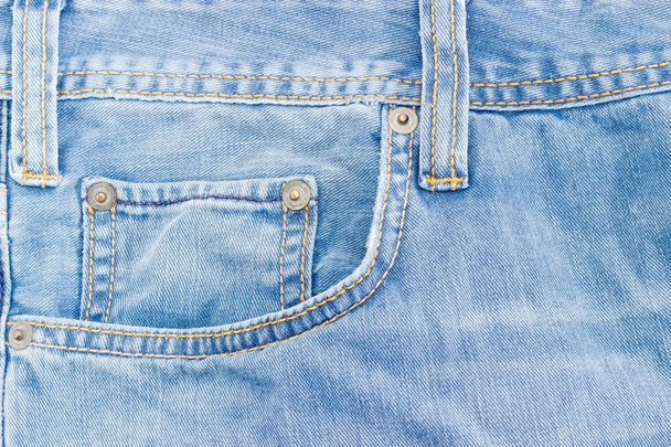 Fragment of the top of the old light blue jeans - Photo, Image