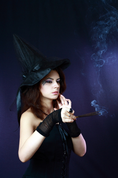 Witch on a dark background - Фото, зображення