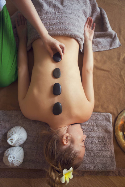 Young woman having massage treatment - Fotó, kép