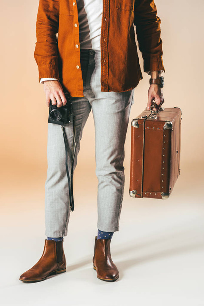 cropped shot of man with photo camera and suitcase - Photo, Image