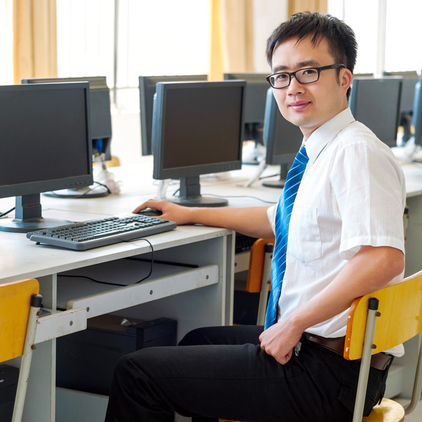 Asian man working in the computer room - Photo, Image