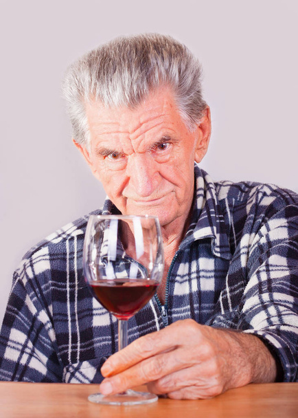 Elderly man with a glass of wine - Photo, Image