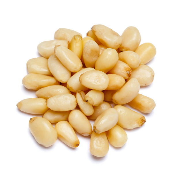 Pine nuts isolated on white - Фото, зображення