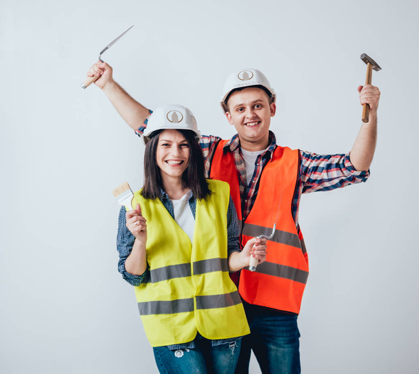 Happy couple making repairs to their home. Home renovation. - Foto, Bild