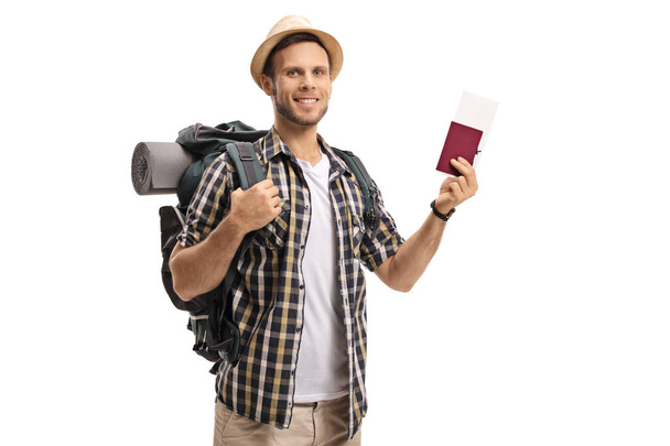 Tourist with a backpack and a passport - Foto, imagen